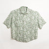 Guayabera oversize color beige con estampado de palmeras